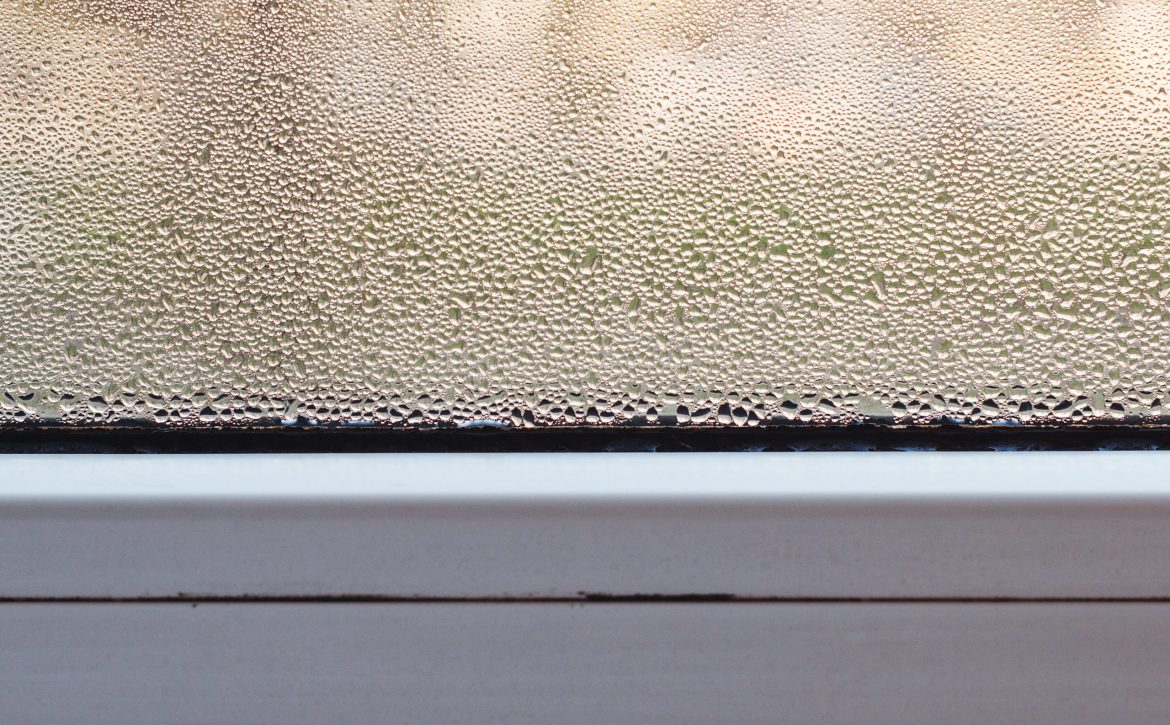 Plastic window with condensation. Double glazed pvc window. Condensation on the glass.